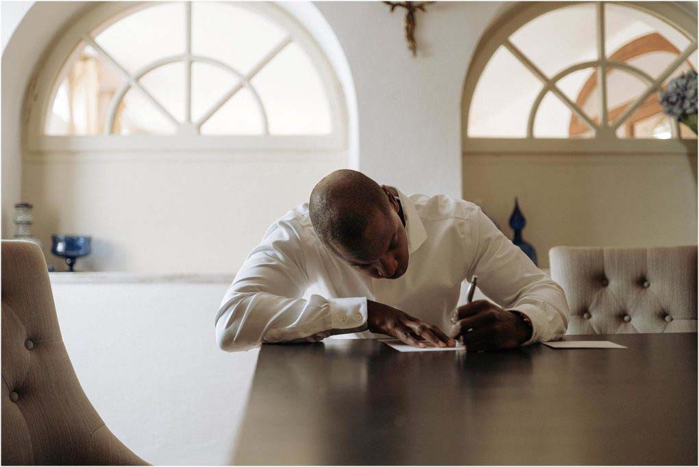 Italian groom writing a letter to his new bride.