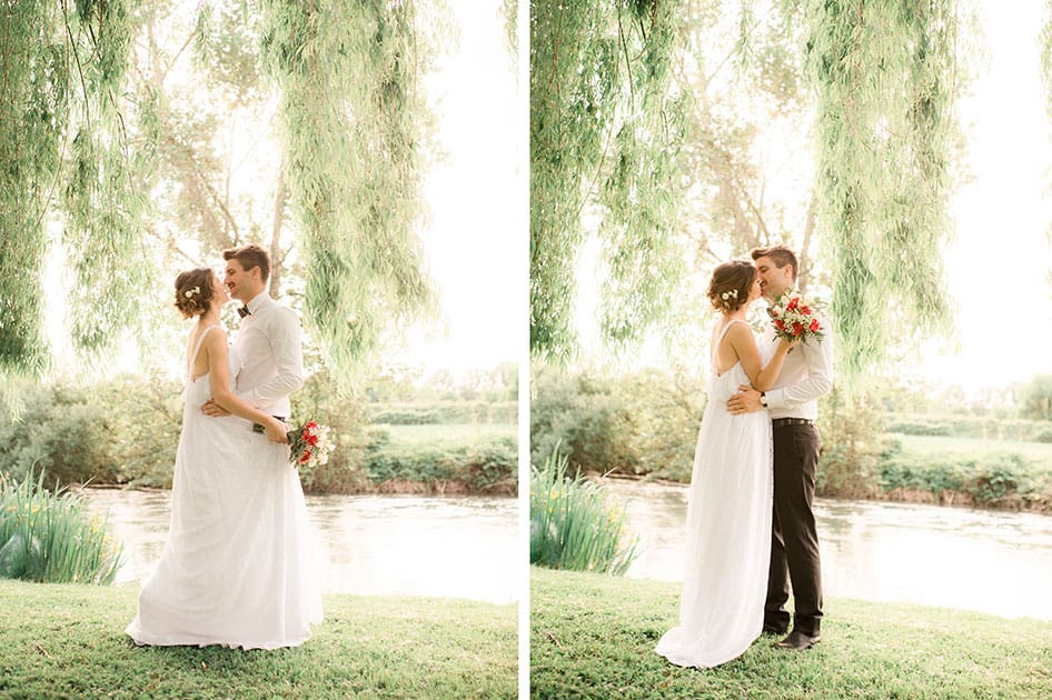 bride and groom dance under the trees and kiss